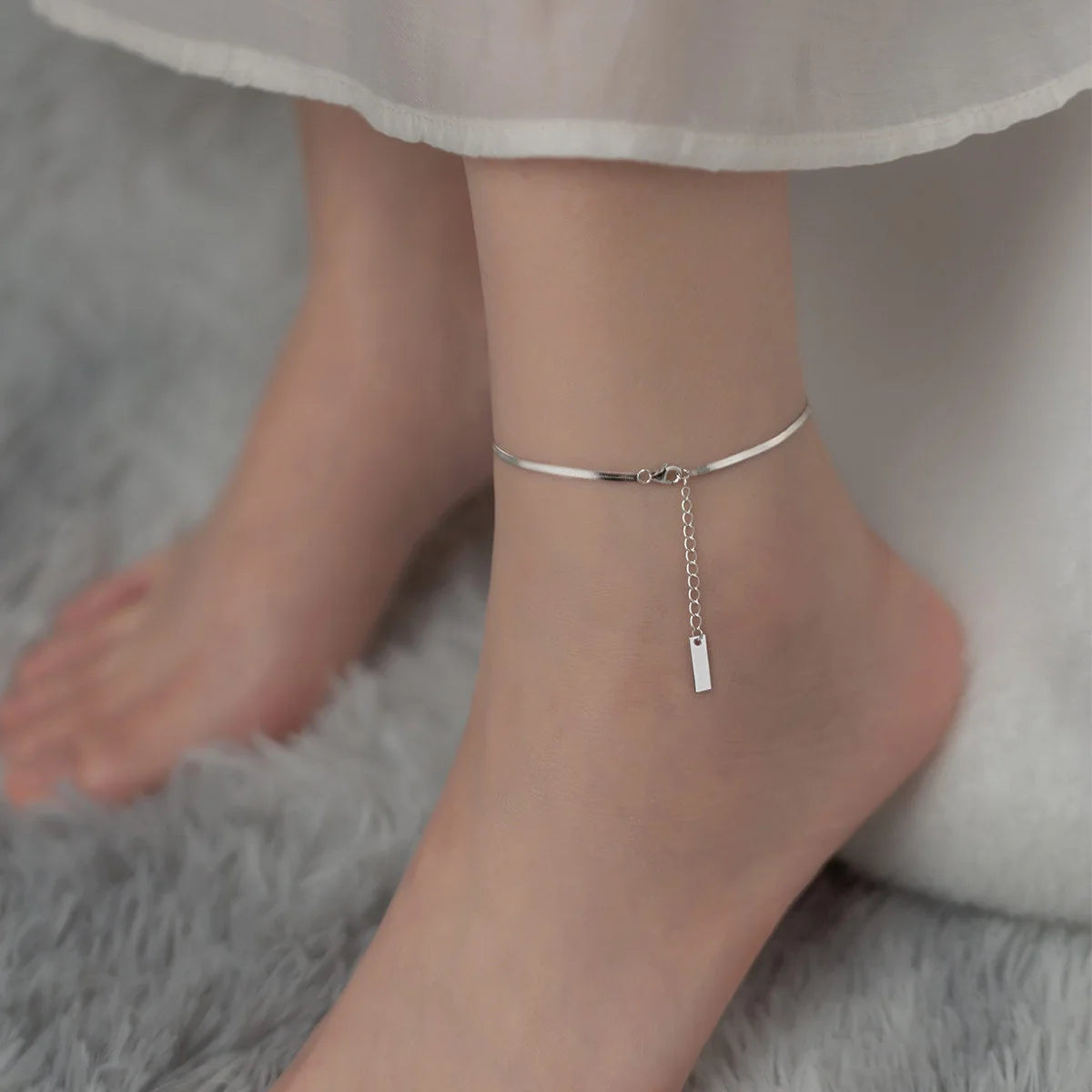 S925 silver snake bone chain anklet in silver and gold finishes, showcasing unique design and craftsmanship.