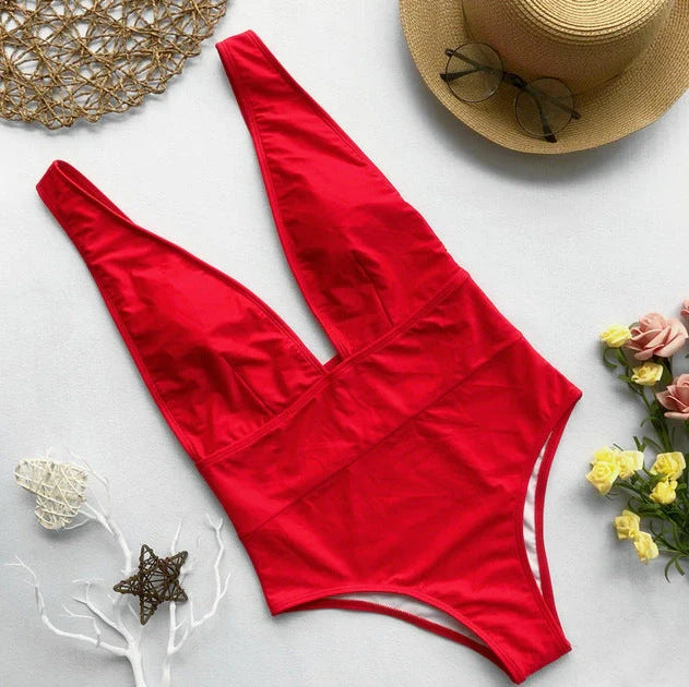 Women's black one-piece swimsuit with steel support structure and Brazilian bikini design