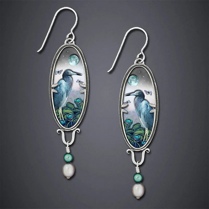 Silver electroplated metal drop earrings with retro bird and flower design