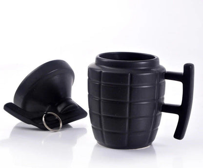 A grenade-shaped ceramic coffee mug with a lid, featuring a military-inspired design for a unique and tactical look.