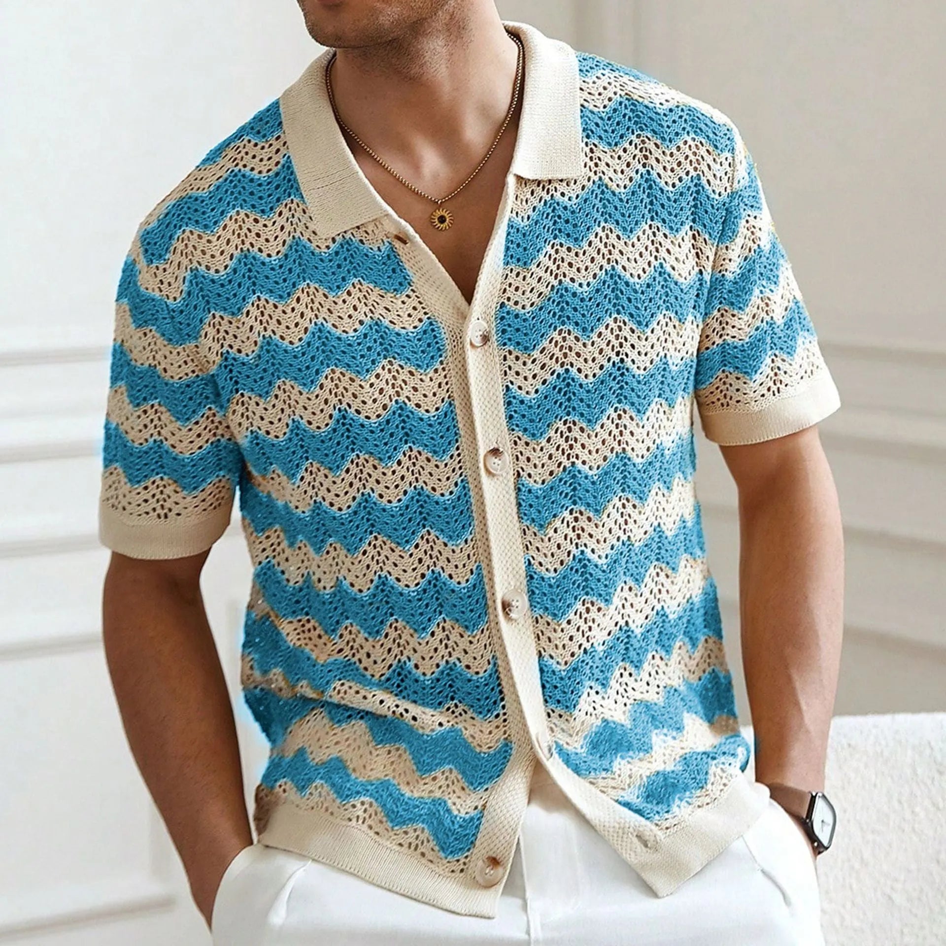 A yellow short-sleeve sweater with a textured corrugated jacquard pattern and a flocked surface detail.