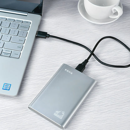 Black and silver 2.5-inch metal mobile hard drive with USB 3.0 connector showing activity light