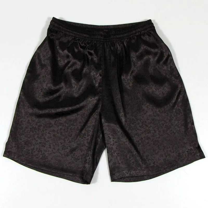 Men's black Tang suit shorts with an elastic drawstring waistband laid flat.