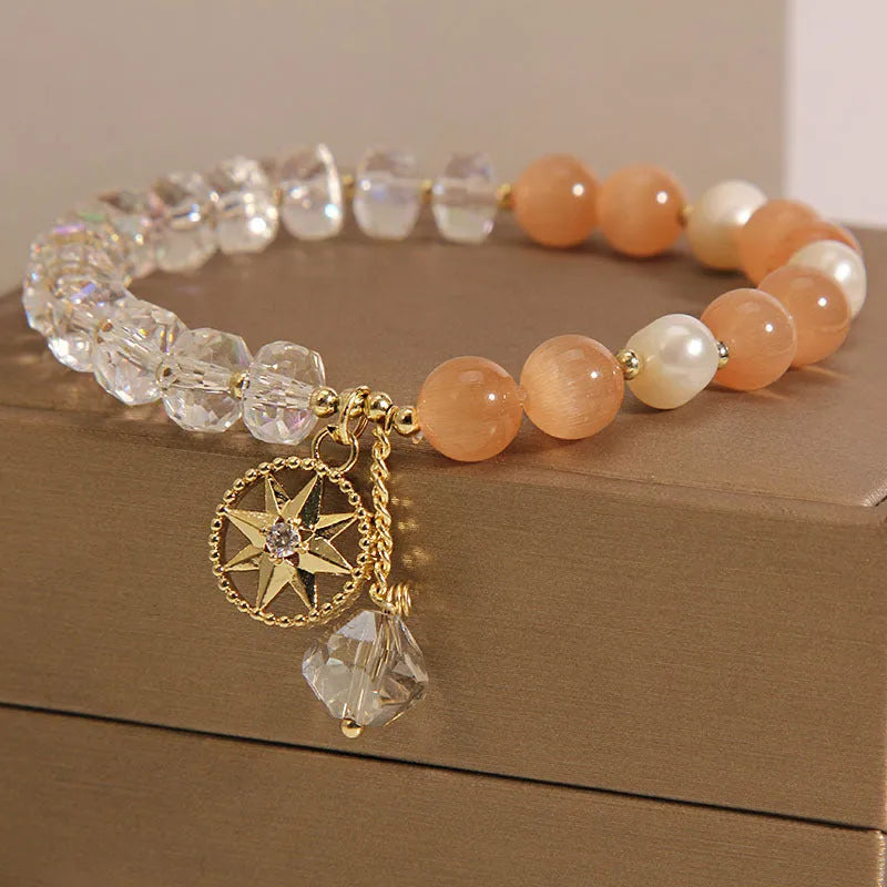 Orange eight Awn star bracelet with gold-plated inlaid gemstones showing detailed design