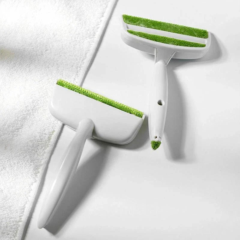 Green plush duster cleaning brush for sofa and pet hair removal