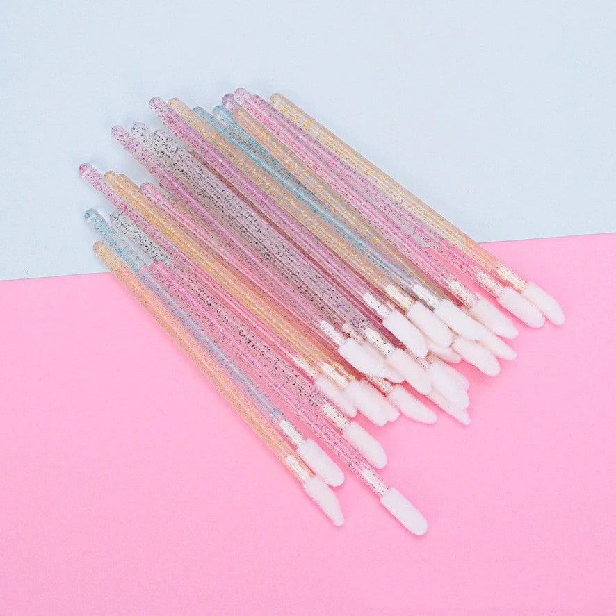 Crystal rod lip brush with synthetic fibre bristles in six colour options on white background