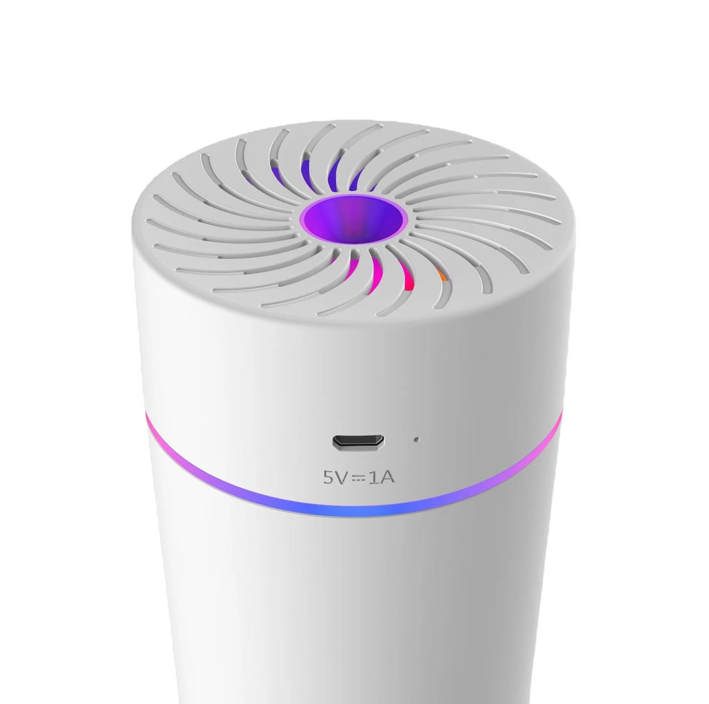 Compact white car USB humidifier with aromatherapy function placed on a car dashboard.