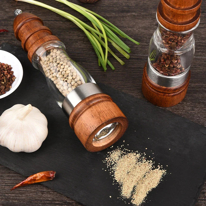 Wooden Salt and Pepper Grinder Set with adjustable coarseness on kitchen table
