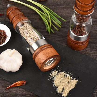 Wooden Salt and Pepper Grinder Set with adjustable coarseness on kitchen table