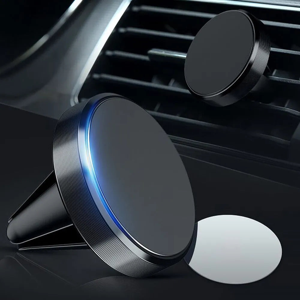Rotating car magnetic phone holder in black on a dashboard air vent with a smartphone attached