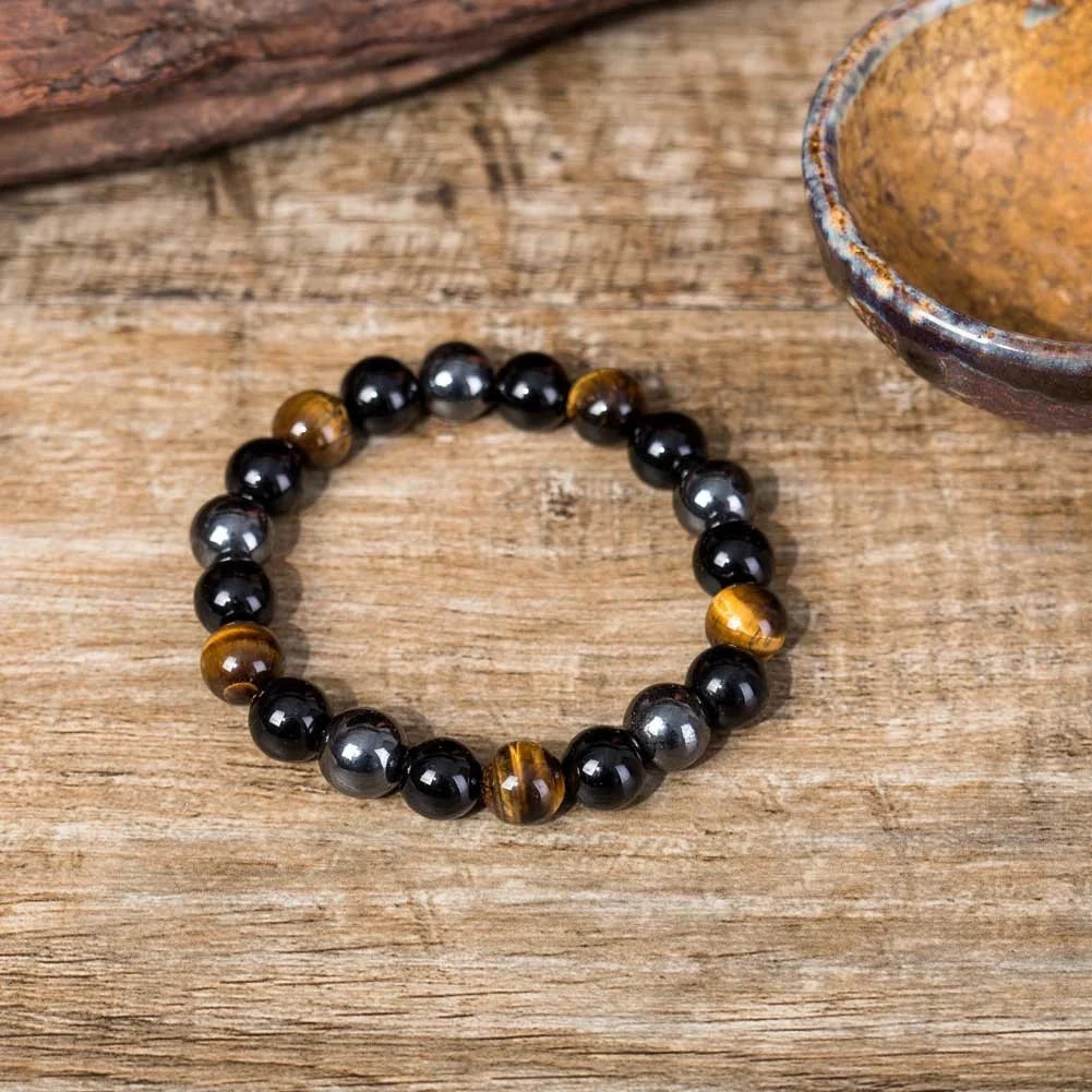 Hand-woven tiger eye stone bracelet in natural colours, showcasing unique texture and geometric design.
