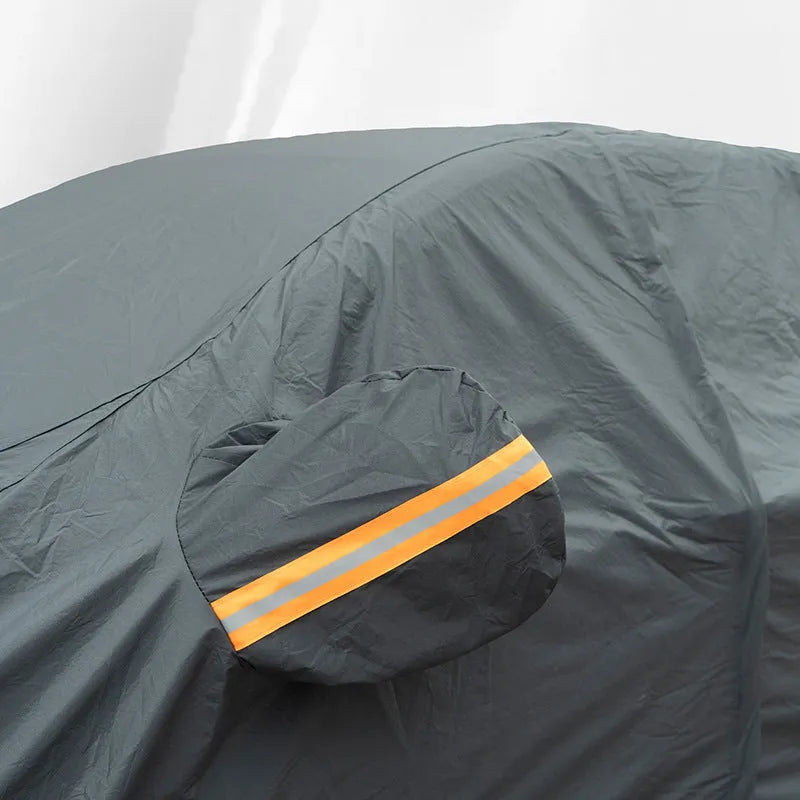 Grey PVC car cover for Volkswagen vehicles showing rainproof and sun protection features
