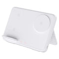 Three-in-one wireless charger in ivory white with a smartphone placed on the charging pad and magnetic support visible