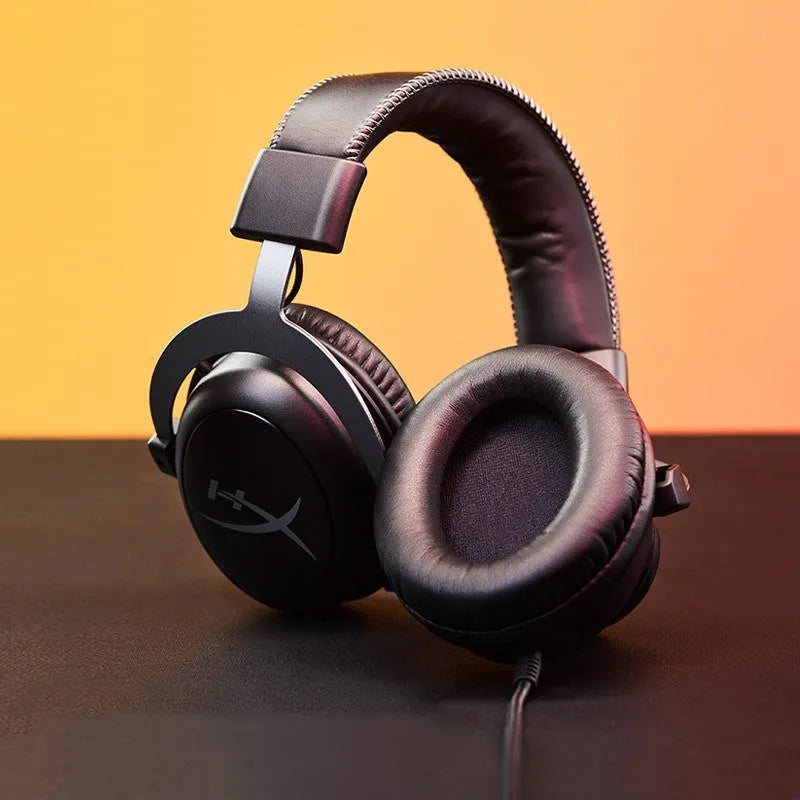 Wired gaming headset with detachable microphone and USB sound card remote in black red colour.