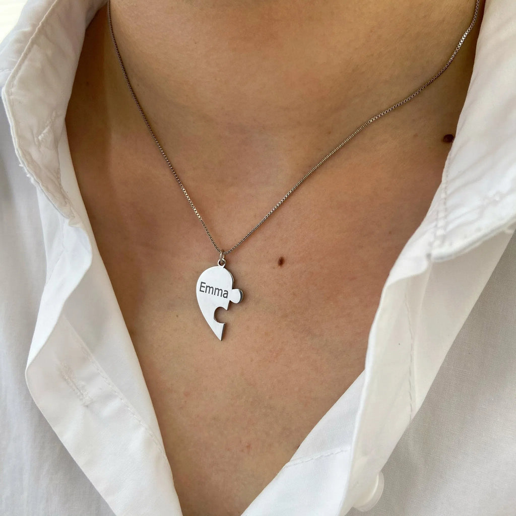 Stainless steel heart-shaped combination pendant necklace in gold finish on white background