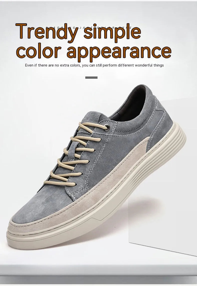 Men's grey pigskin leather low-top casual skate shoes with round toe and flat rubber sole.
