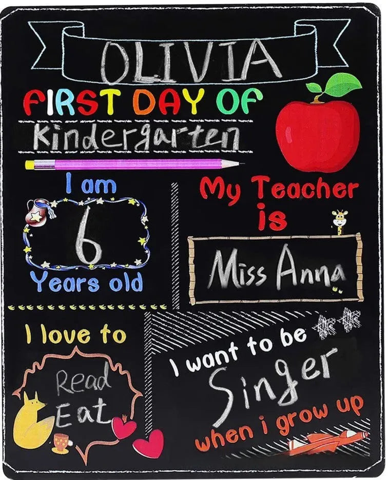 Black wooden First Day of School sign with white chalkboard text, measuring 25.5 by 30 centimetres.