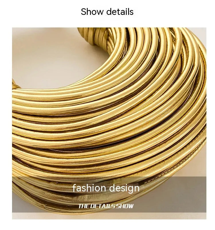 Instafamous Metal Noodles Underarm Bag with shiny metallic surface, chain detail, in gold colour