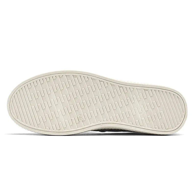 Men's beige linen canvas slip-on shoes with a round toe and shallow cut on a plain background.