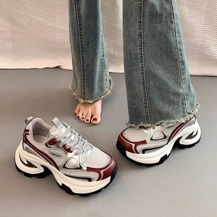 Women's Red and Silver clunky platform sneakers with mesh lining and rubber sole on a white background.