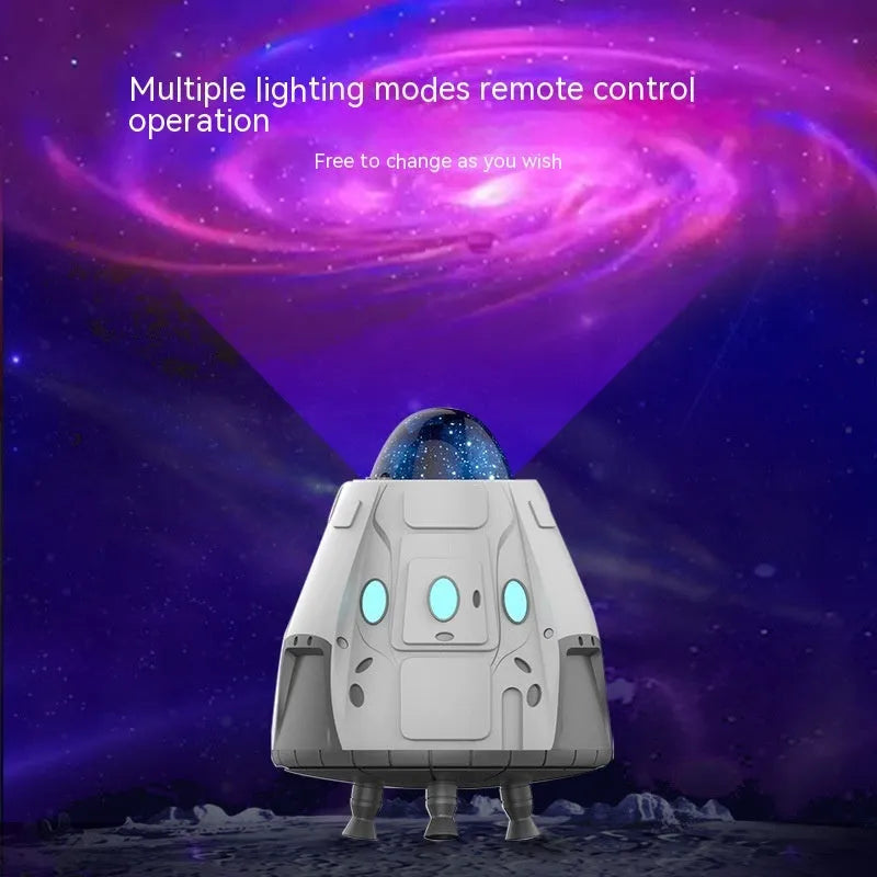 White capsule-shaped Bluetooth northern lights starry sky ambience light projector with remote control.