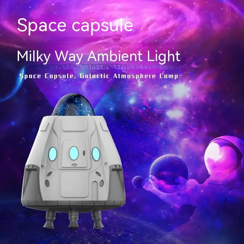 White capsule-shaped Bluetooth northern lights starry sky ambience light projector with remote control.