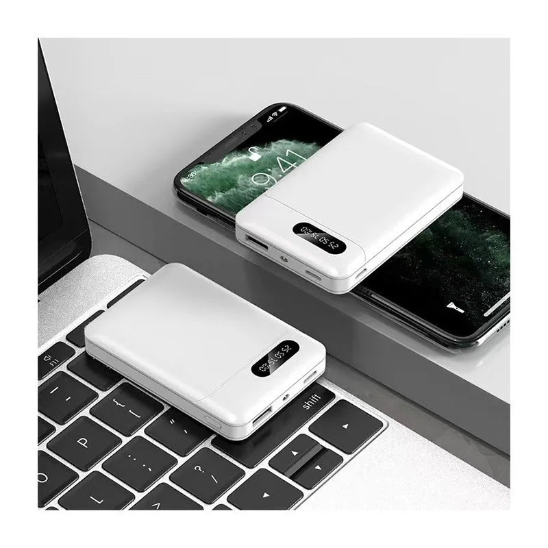 White and black portable power bank with multiple USB ports showing 10000mAh capacity label