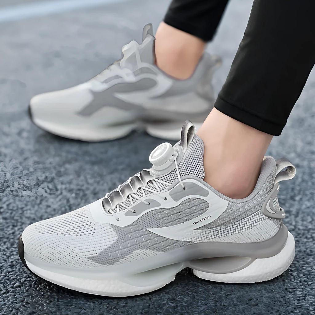 Men's white Fly-knit mesh running shoes with a rotating buckle fastener and TPU sole.