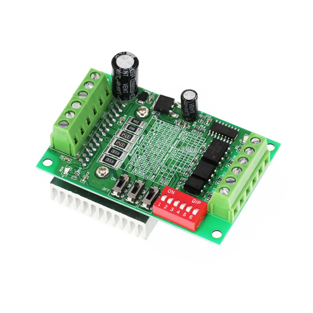 TB6560 stepper motor driver module on a green PCB with a large heatsink, showing connection terminals.