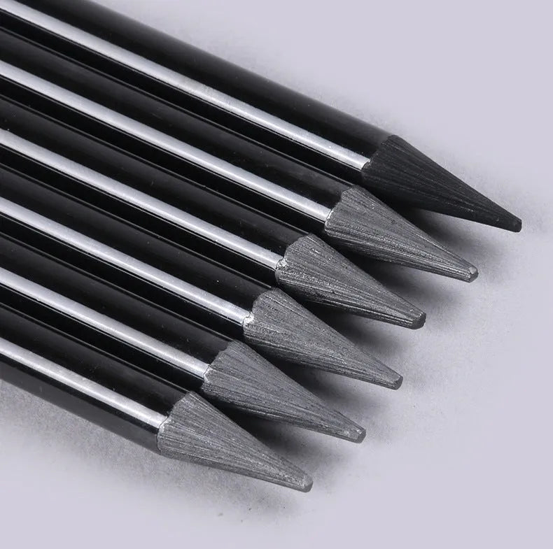 Set of graphite and carbonized drawing pencils with wooden barrels on suction card packaging
