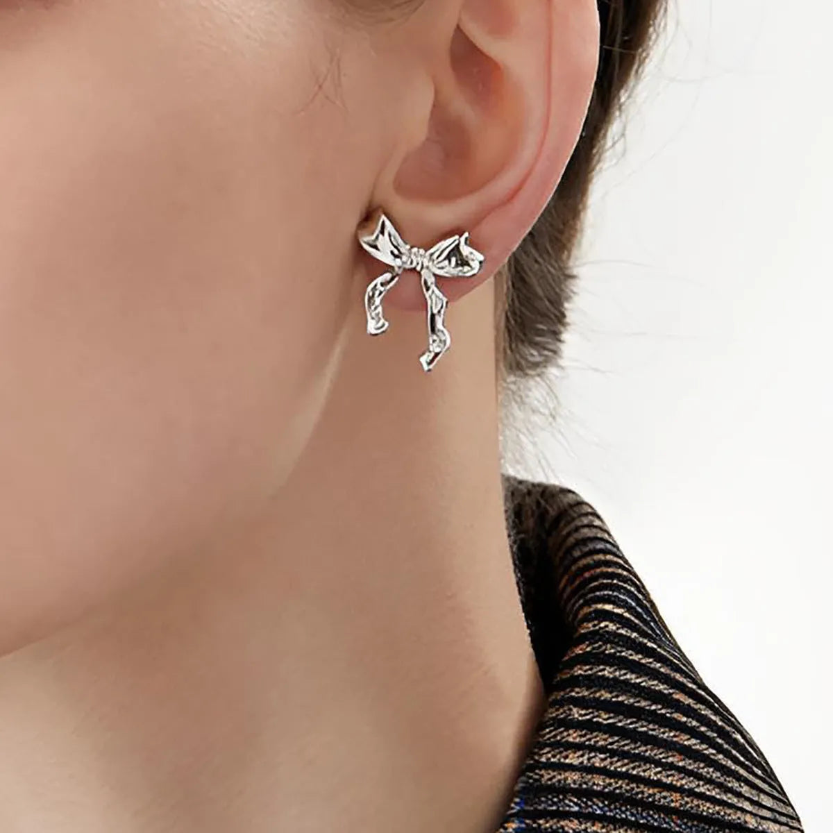 Gold bow earrings simple style alloy with electroplated finish