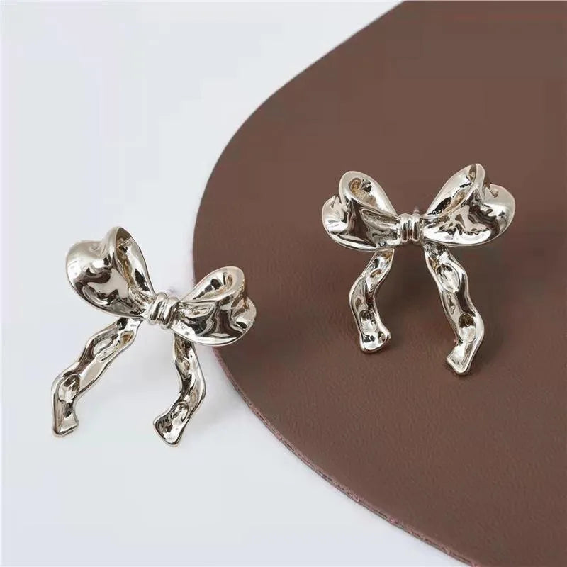 Gold bow earrings simple style alloy with electroplated finish