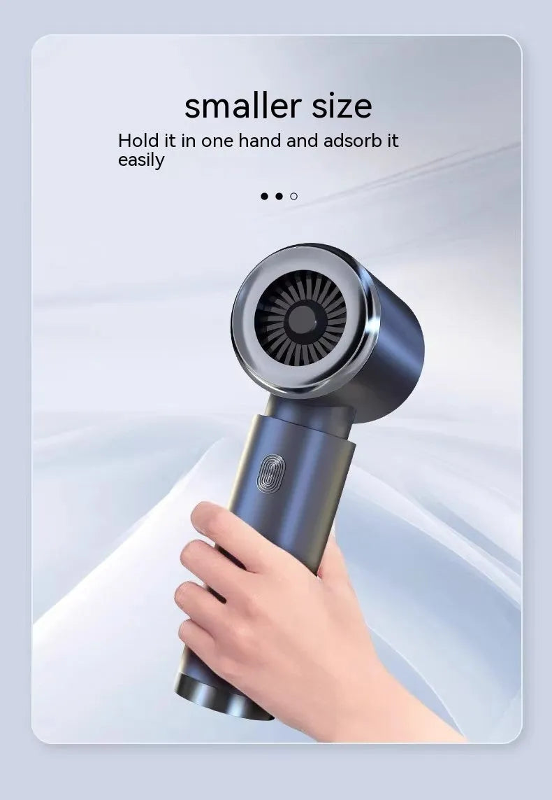 Handheld car vacuum cleaner in space gray with strong suction nozzle for vehicle interior cleaning