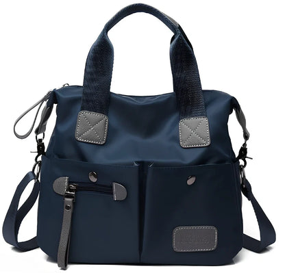 Ladies shoulder bag in black Oxford fabric, size M with multiple pockets and adjustable straps for handbag or crossbody carry, 340 mm width