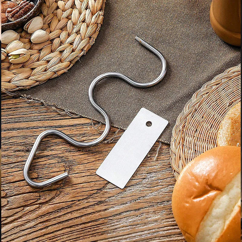 Stainless steel peanut butter mixer sauce stirring rod on white background
