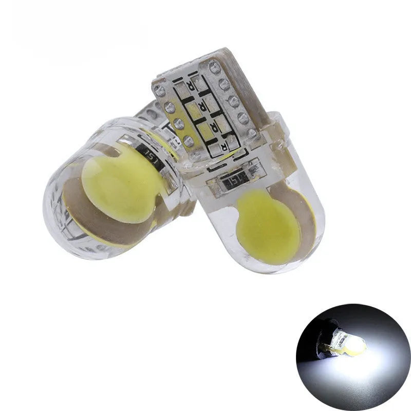 Ten silicone T10 LED car bulbs in various colours including white, red, blue, and yellow on a white background.