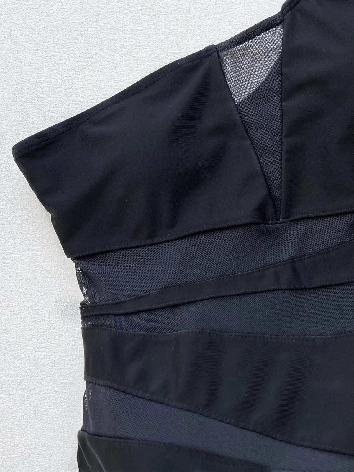 Black one-piece swimsuit for women with polyester-spandex lining in S, M, L sizes