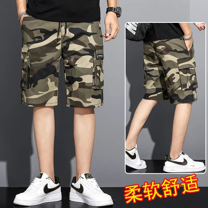 Men's camouflage 5-point workwear shorts in green, front view, with drawstring waist and mid-thigh length