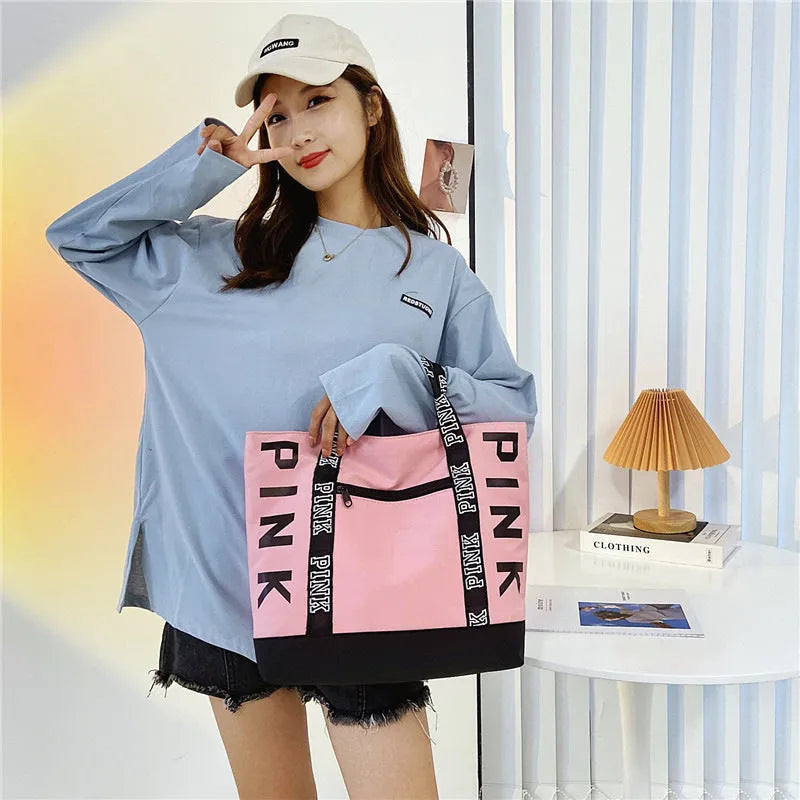 Soft canvas handbag with large capacity, horizontal square shape, double shoulder straps, and sandwich pocket in pink