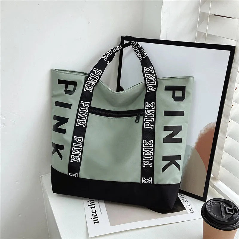 Soft canvas handbag with large capacity, horizontal square shape, double shoulder straps, and sandwich pocket in pink