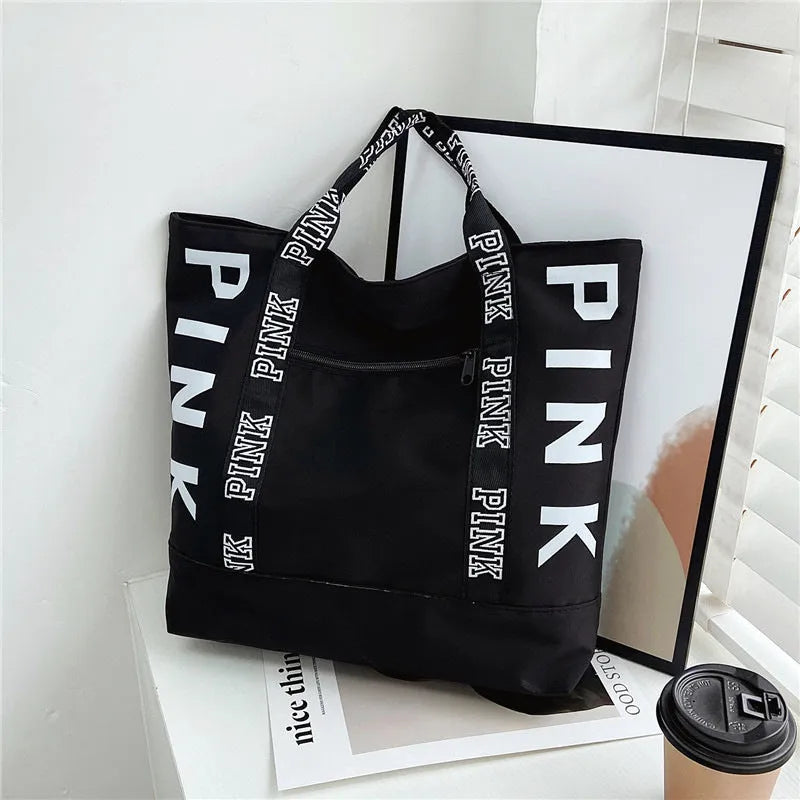 Soft canvas handbag with large capacity, horizontal square shape, double shoulder straps, and sandwich pocket in pink