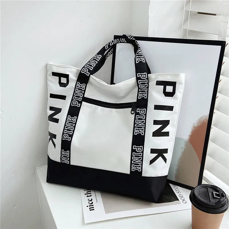 Soft canvas handbag with large capacity, horizontal square shape, double shoulder straps, and sandwich pocket in pink