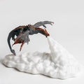 3D printed red dragon night light glowing on a table, showing detailed scales and wings, with a USB cable.
