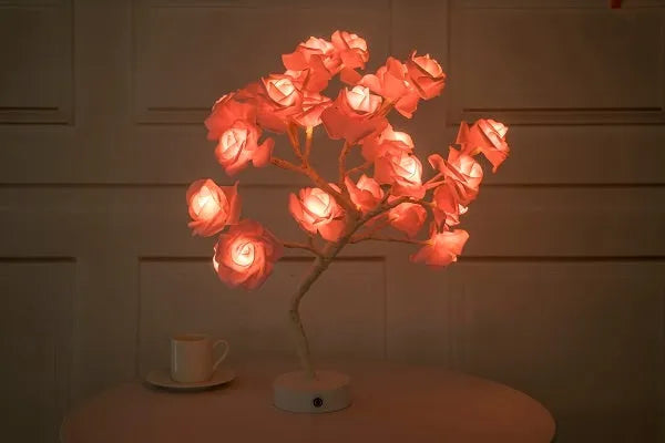 White and red rose flower LED table lamp with warm white lights on wooden surface