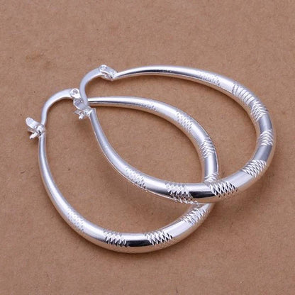 Silver-plated copper hoop earrings with 925 silver treatment, 3.9cm by 3.2cm
