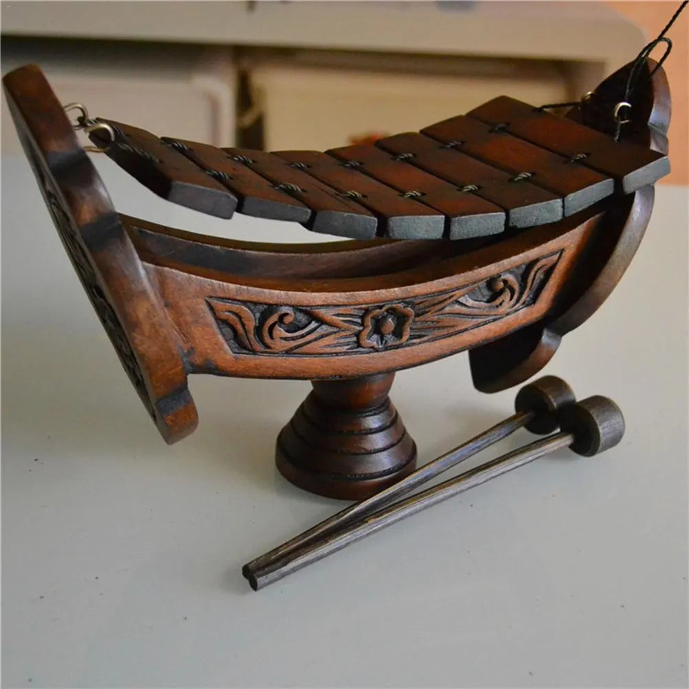 Brown wooden hand xylophone decorative pendant measuring 27x16cm in Southeast Asian style