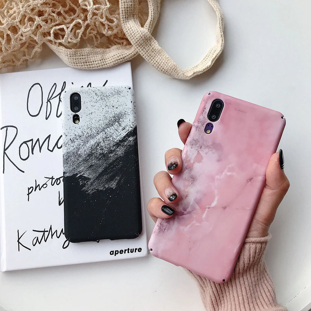 Solid black and solid pink painted phone back covers for Huawei and Honor smartphones on a white background.