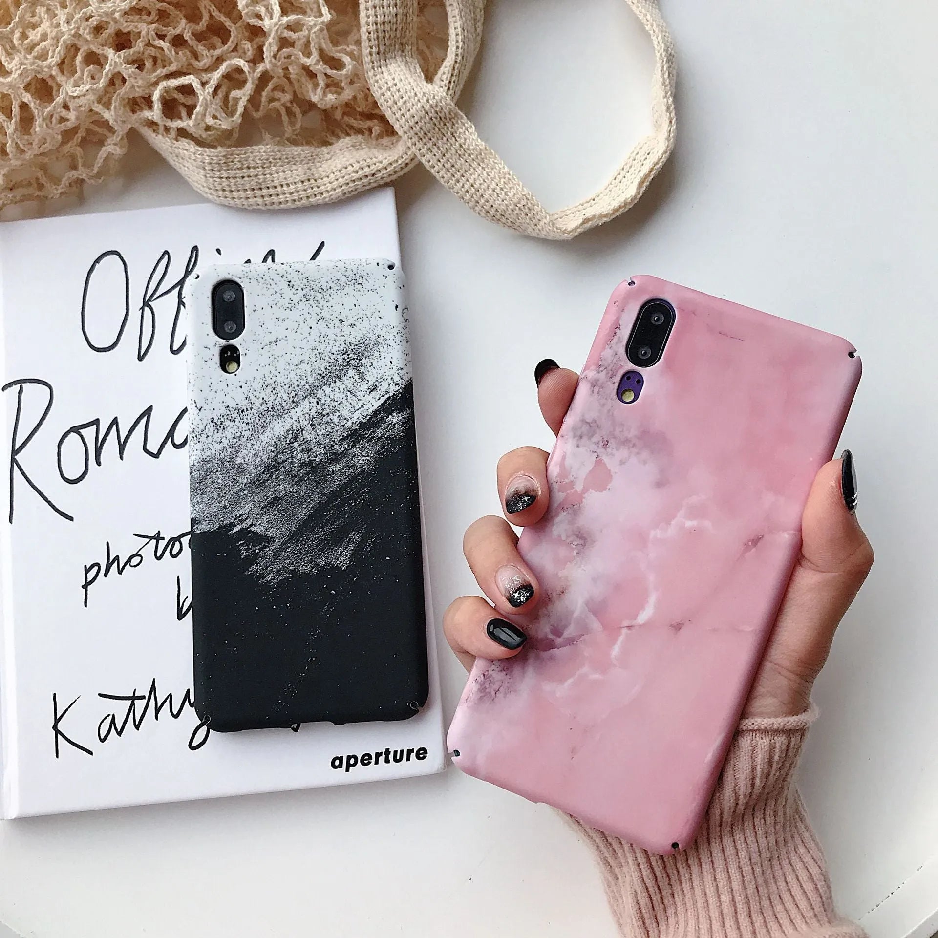 Solid black and solid pink painted phone back covers for Huawei and Honor smartphones on a white background.