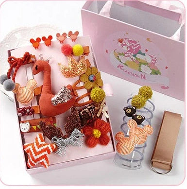 24-piece children's hair clip set with cartoon animal designs including blue fox and pink elephant