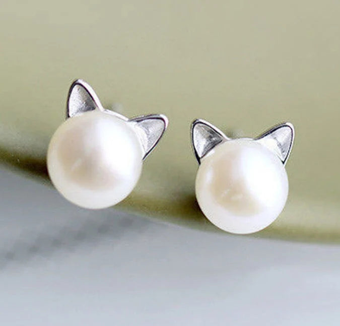 Cat-themed earrings in silver and gold, lightweight and stylish